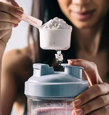 close-up-women-with-measuring-scoop-whey-protein-shaker-bottle-preparing-protein-shake